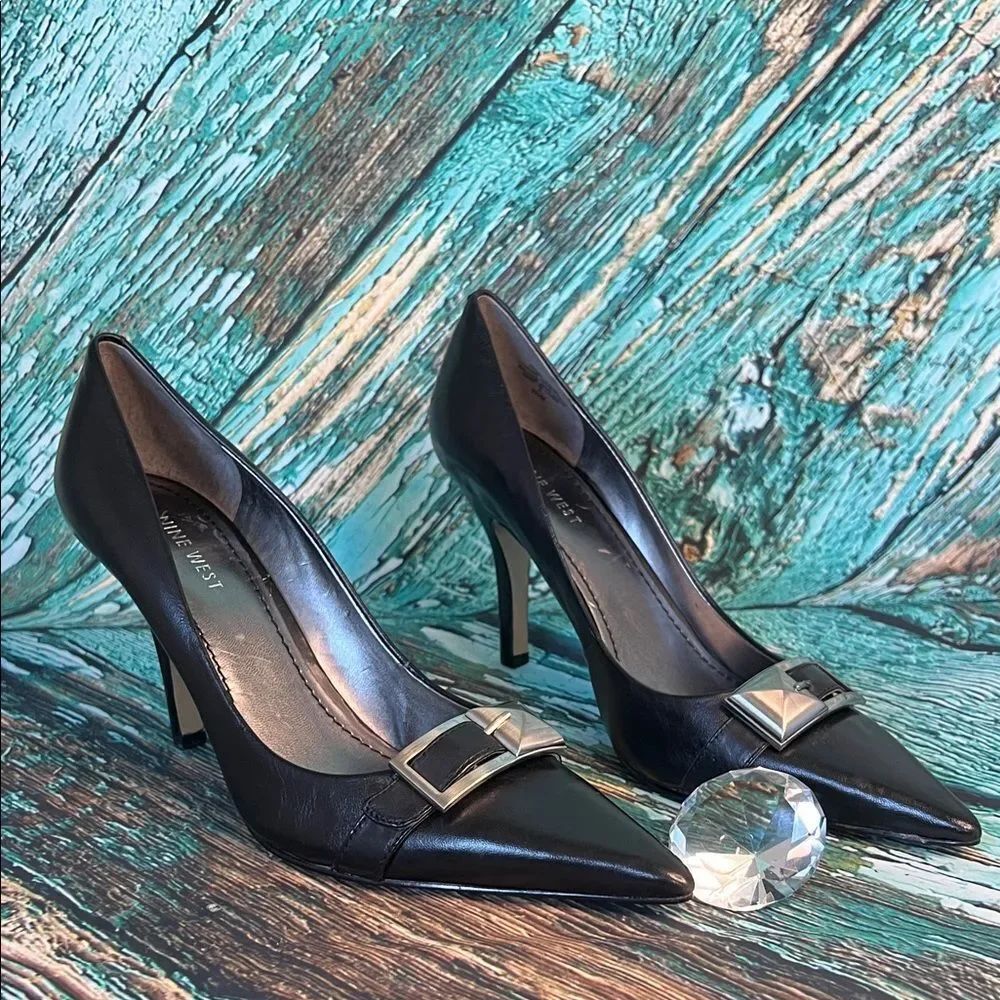 * Nine WestβBelltown black leather dress heels with a silver buckle accent